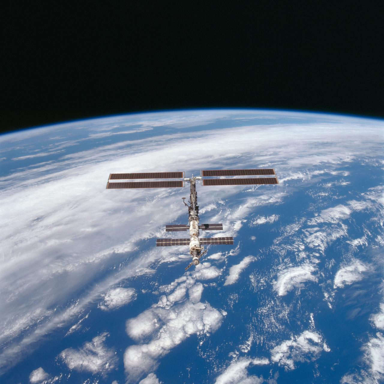 STS097-703-090 (9 December 2000) --- This picture is one of a series of 70mm frames exposed of the International Space Station (ISS) following undocking at 1:13 p.m. (CST), December 9, 2000. This series of images, as well as video and digital still imagery taken at the same time, represent the first imagery of the entire station with its new solar array panels deployed. Before separation, the shuttle and space station had been docked to one another for 6 days, 23 hours and 13 minutes. Endeavour moved downward from the space station, then began a tail-first circle at a distance of about 500 feet. The maneuver, with pilot Michael J. Bloomfield at the controls, took about an hour. While Endeavour flew that circle, the two spacecraft, moving at five miles a second, navigated about two-thirds of the way around the Earth. Undocking took place 235 statute miles above the border of Kazakhstan and China. When Endeavour made its final separation burn, the orbiter and the space station were near the northeastern coast of South America.