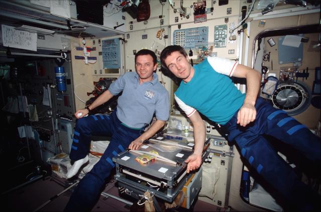 Expedition One crewmembers pose for photo in Service Module