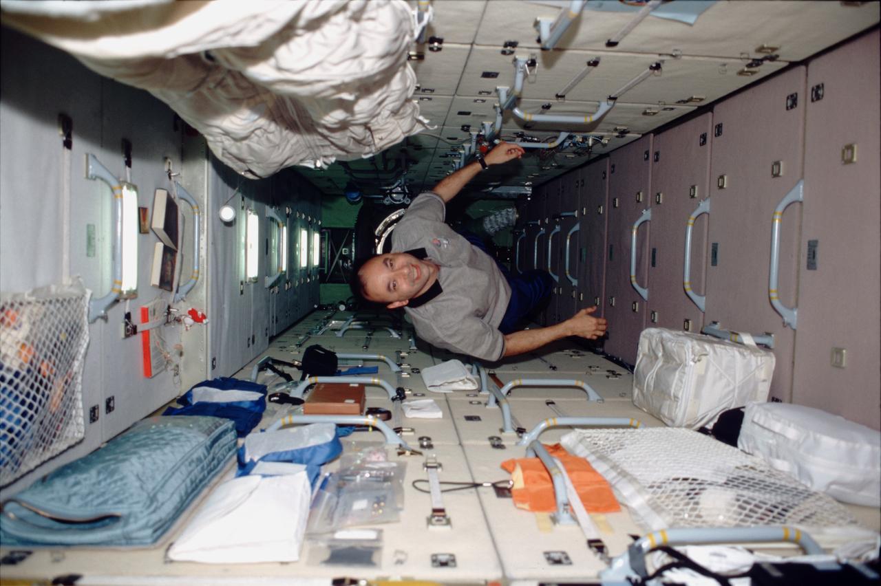 STS098-320-008 (7-20 February 2001) --- Astronaut Mark L. Polansky, STS-98 pilot, translates through the Zarya functional cargo block (FGB) while visiting and working aboard the International Space Station (ISS).