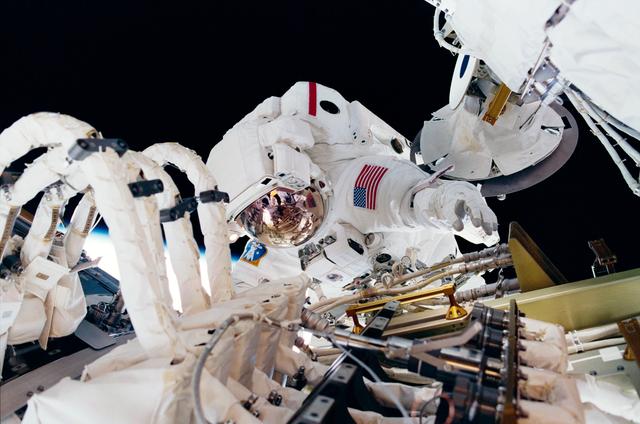 NASA image:  MS Jones installs cables and connectors on U.S. Laboratory / Destiny Module
