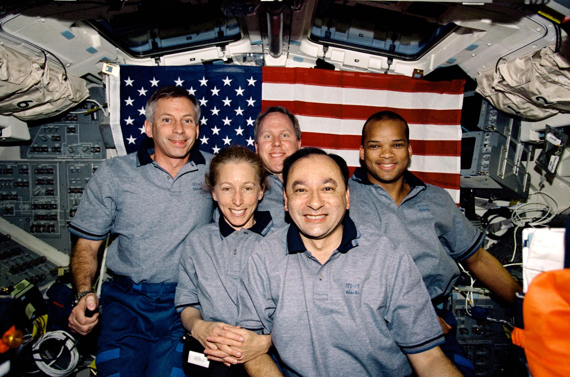 STS098-365-0034 (7-20 February 2001) --- The crew of the STS-98 mission poses for the traditional inflight portrait on the flight deck of the Space Shuttle Atlantis. From left are astronauts Kenneth D. Cockrell, mission commander; Marsha S. Ivins, mission specialist; Thomas D. Jones, mission specialist; Mark L. Polansky, pilot; and Robert L. Curbeam, mission specialist.