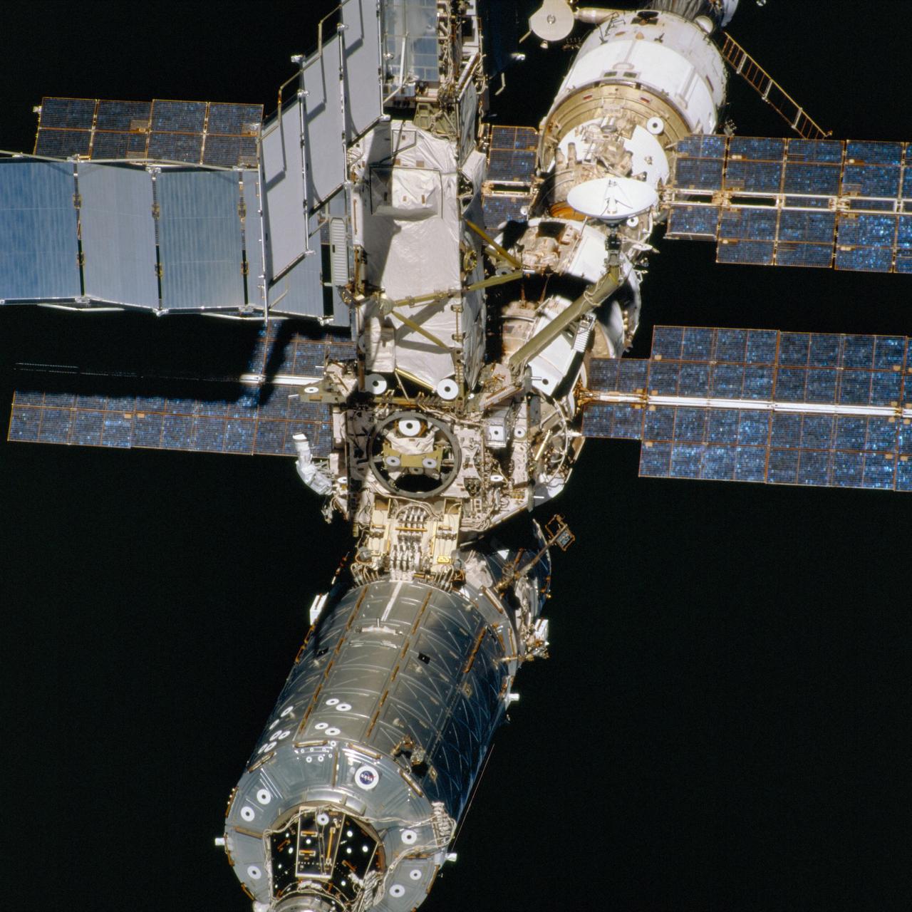 STS098-706-004 (16 February 2001) --- The International Space Station (ISS)is backdropped against the blackness of space in this medium-distance, 70mm frame, as photographed from the departing Space Shuttle Atlantis. The newly installed Destiny laboratory is in the left foreground. The crews of the Space Shuttle Atlantis and the International Space Station parted company at 8:06 a.m. (CST), Febraury 16, as astronaut Mark L. Polansky, pilot, flew the shuttle halfway around the station and its new Destiny laboratory before moving off.