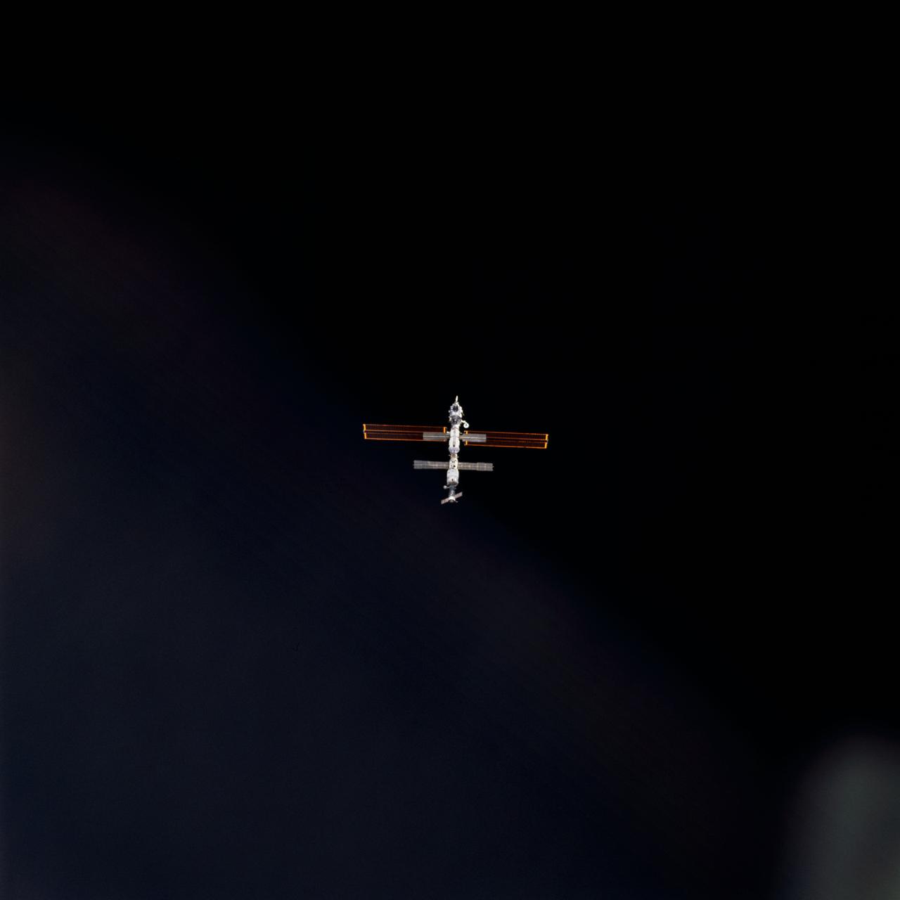 STS098-707-008 (9 February 2001) --- This picture of the distant International Space Station (ISS), backdropped against the blackness of space, was photographed by one of the astronauts onboard the Space Shuttle Atlantis at it approached the station for docking on Feb. 9, at 10:51 a.m. (CST).