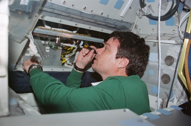 NASA image: STS-99 Commander Kregel works on the DDRE on OV-105's flight deck