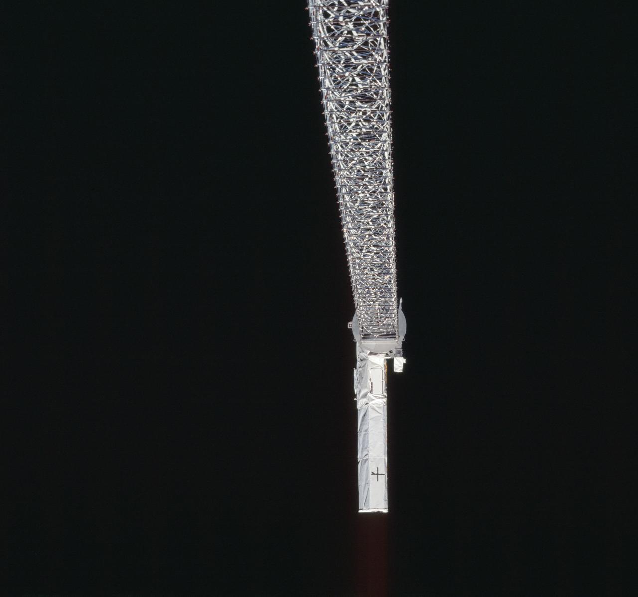 A view of the SRTM's 200 ft. boom deployed from OV-105 during STS-99