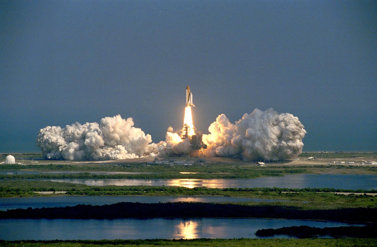 STS099-S-019 (11 February 2000) --- The Space Shuttle Endeavour is backdropped in the distance against a clear blue sky as its launches toward space.  Launch of the STS-99 mission occurred at 12:43:40 p.m. (EST), February 11, 2000 from Launch Pad 39A with a crew of six aboard.  This is the 97th shuttle flight and the 14th for Space Shuttle Endeavour.