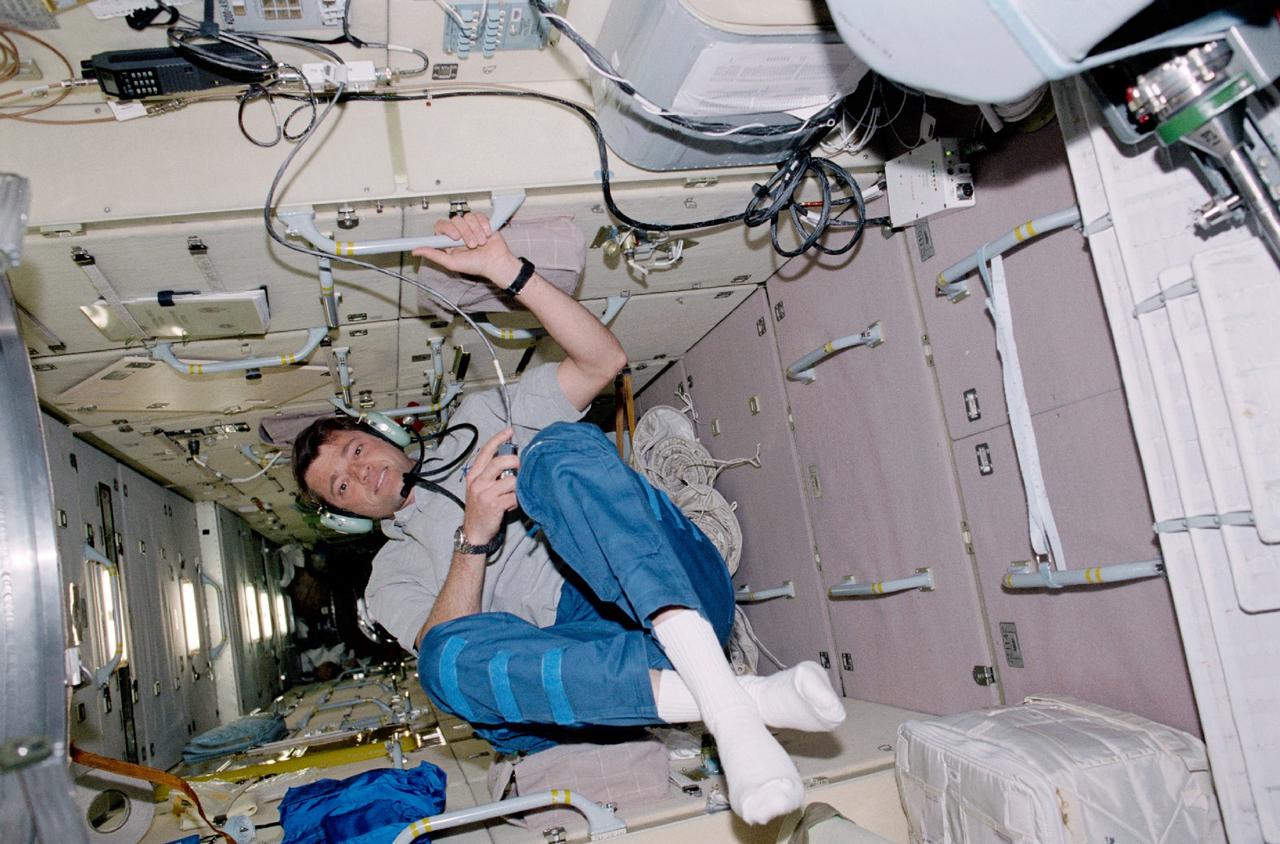 STS100-345-015 (19 April-1 May 2001) ---  Astronaut Jeffrey S. Ashby,  STS-100 pilot, talks to amateur radio operators on the ground from a special work station on the functional cargo block (FGB) or Zarya module of the International Space Station (ISS).
