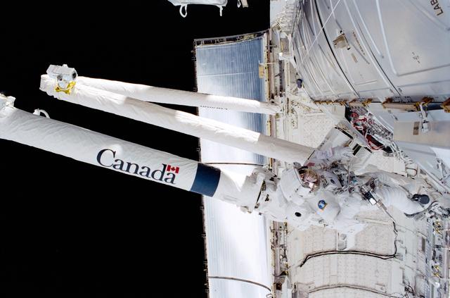 NASA image: MS Parazynski works with cables for Destiny during the second EVA of STS-100