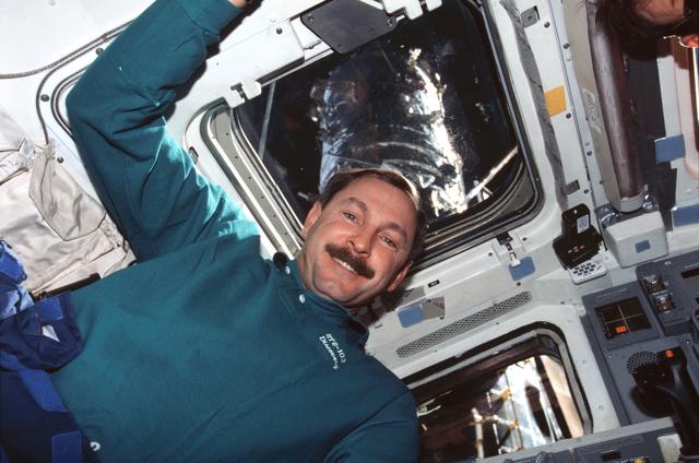 NASA image: Various views of the STS-103 crew on the aft flight deck