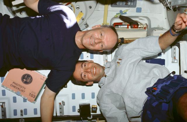 NASA image: Various views of the STS-103 crew on the middeck