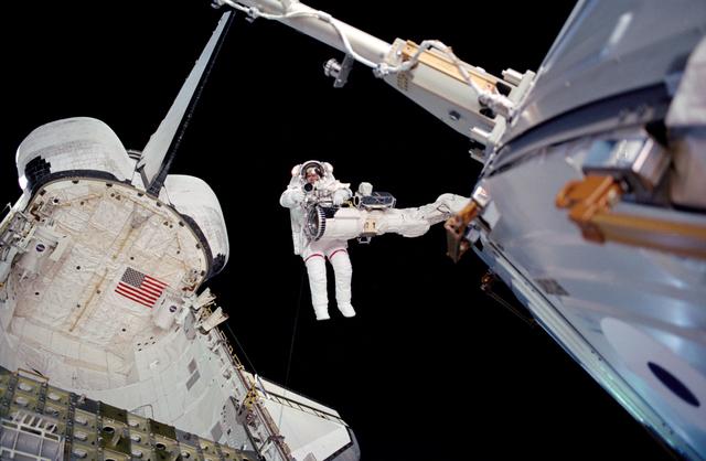 NASA image: Barry on the RMS above the payload bay during EVA2