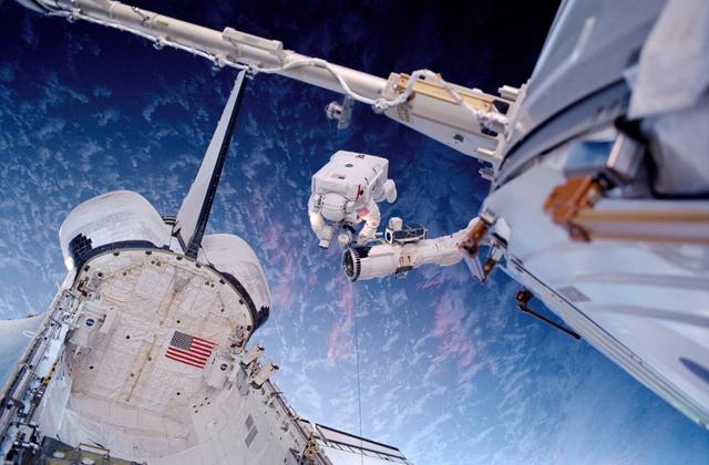 NASA image: Barry on the RMS above the payload bay during EVA2