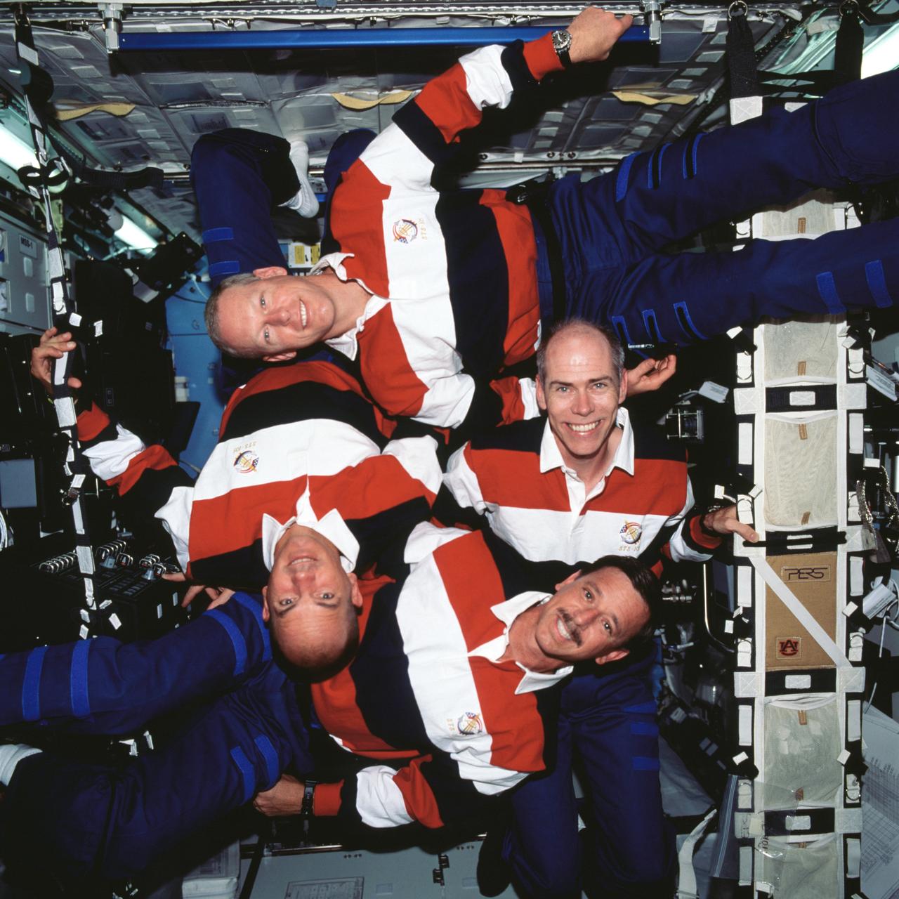 STS105-717-060 (17 August 2001) --- The four STS-105 crew members pose for the traditional in-flight crew portrait in the Destiny laboratory on the International Space Station (ISS). Clockwise from left bottom, are Scott J. Horowitz and Frederick W. (Rick) Sturckow, commander and pilot, respectively; Patrick G. Forrester and Daniel T. Barry, both mission specialists.