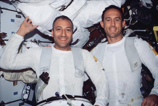 NASA image: STS-109 MS Newman and Massimino in airlock after EVA