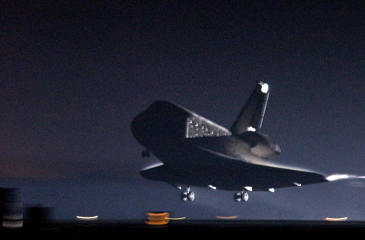 STS109-S-016 (12 March 2002)--- The Space Shuttle Columbia, with its crew of seven astronauts on board, approaches touchdown on Runway 33 of the KSC Shuttle Landing Facility, completing mission STS-109 to service the Hubble Space Telescope. Wheel stop occurred on orbit 165 at 4:33:09 a.m. EST with mission elapsed time of 10 days, 22 hours, 11 minutes. Main gear touchdown occurred at 4:31:52 a.m. and nose wheel touchdown an 4:32:02. It was the 58th landing at KSC out of 108 missions in the history of the Shuttle program.