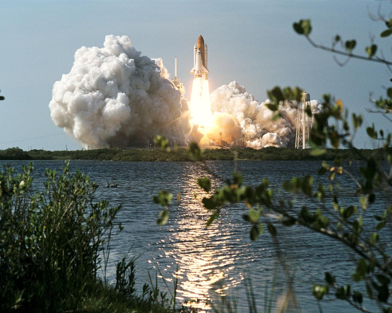 STS110-S-005 (8 April 2002) --- The Space Shuttle Atlantis lifts off from KSC's Launch Complex 39 at 4:44:19 p.m. (EDT), April 8, 2002. Seven astronauts were en route to the International Space Station (ISS) for a week of work on the orbital outpost, including the installation of the S0 (S-zero) truss.