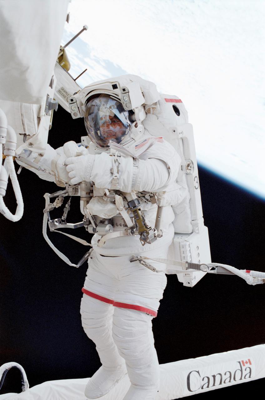 STS111-306-023 (9 June 2002) --- Astronaut Franklin R. Chang-Diaz, STS-111 mission specialist, participates in the first scheduled session of extravehicular activity (EVA) for the STS-111 mission. During the spacewalk, Chang-Diaz and Perrin attached a Power and Data Grapple Fixture onto the International Space Station’s (ISS) P6 Truss, setting the stage for the future relocation of the P6. The next major task was to remove Service Module Debris Panels from Space Shuttle Endeavour’s payload bay and attach them to their temporary location on Pressurized Mating Adapter 1 (PMA-1). The spacewalkers also removed thermal blankets to prepare the Mobile Base System (MBS) for installation onto the station’s Mobile Transporter (MT).