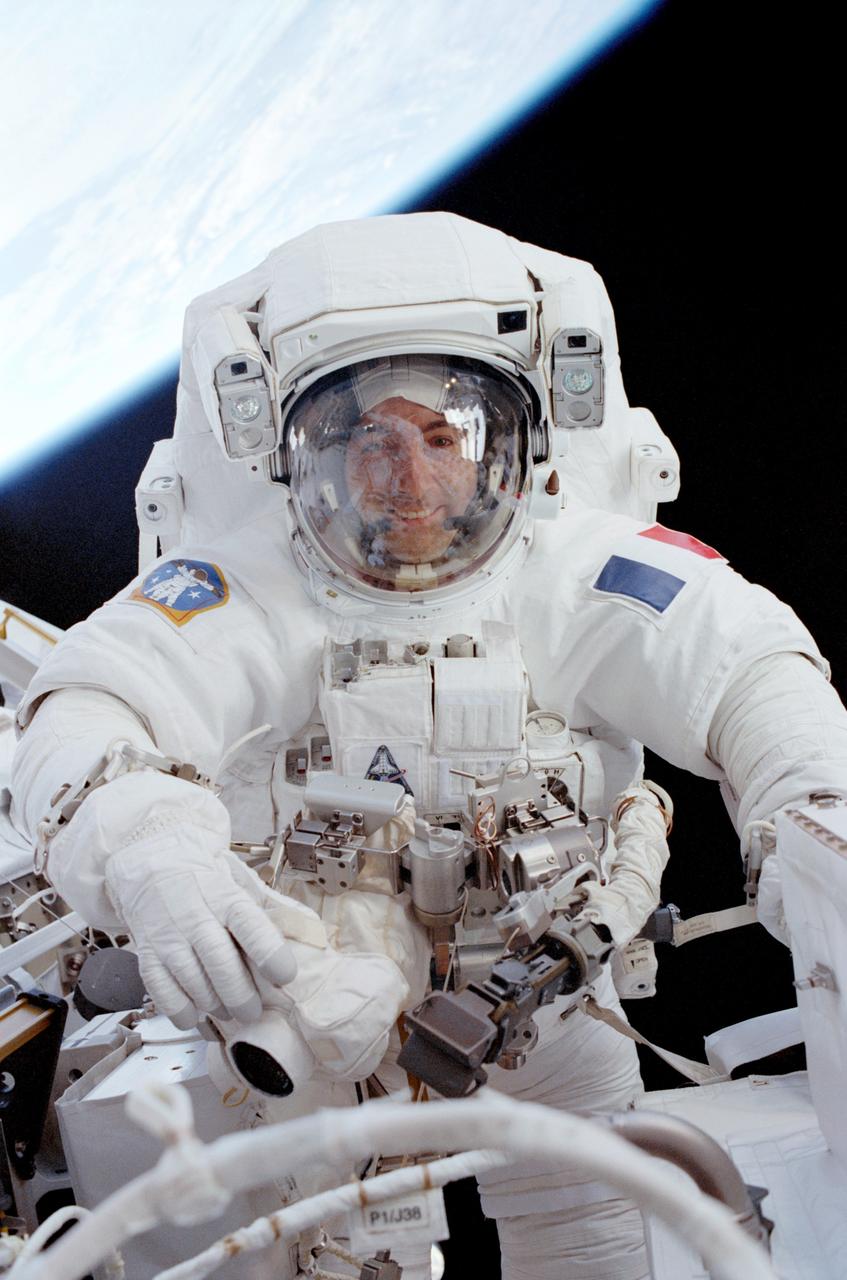 STS111-307-017 (11 June 2002) --- Astronaut Philippe Perrin, STS-111 mission specialist representing CNES, the French Space Agency, participates in the second scheduled session of extravehicular activity (EVA) for the STS-111 mission. During the spacewalk, Perrin and Chang-Diaz attached power, data and video cables from the International Space Station (ISS) to the Mobile Base System (MBS) and used a power wrench to complete the attachment of the MBS onto the Mobile Transporter (MT).