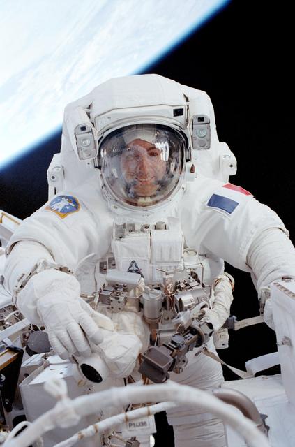 Perrin smiles through the visor of his EVA helmet while working beside the MBS during STS-111 EVA 2