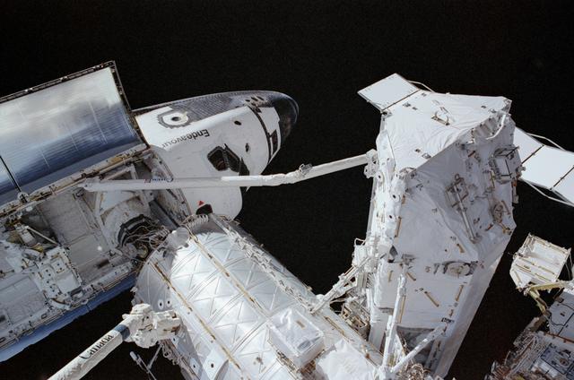 NASA image: Endeavour, PMA2, RMS, and S0 (S-zero) truss photographed during STS-111 UF-2 EVA 1