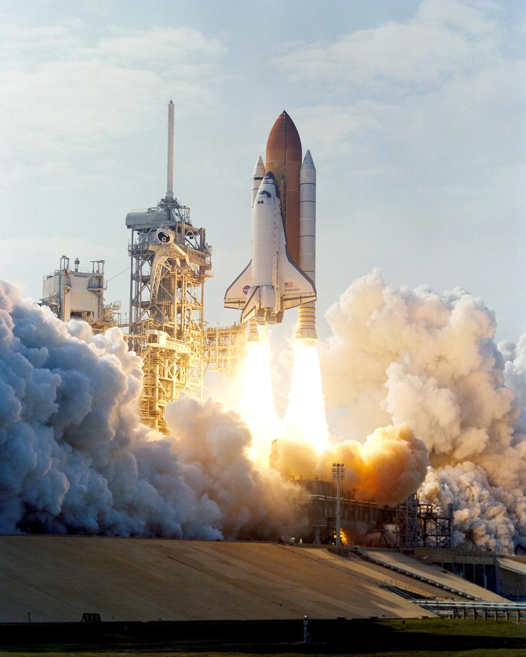 STS111-S-007 (5 June 2002) --- The Space Shuttle Endeavour lifts off, creating billows of smoke and steam on its way into space for mission STS-111 to the International Space Station (ISS). Liftoff occurred at 5:22:49 p.m. (EDT), June 5, 2002. The STS-111 crew includes astronauts Kenneth D. Cockrell, commander; Paul S. Lockhart, pilot, and Franklin R. Chang-Diaz and Philippe Perrin, mission specialists. Also onboard were the Expedition Five crew members including cosmonaut Valery G. Korzun, commander, along with astronaut Peggy A. Whitson and cosmonaut Sergei Y. Treschev, flight engineers. Perrin represents CNES, the French space agency, and Korzun and Treschev are with the Russian Aviation and Space Agency (Rosaviakosmos). This mission marks the 14th Shuttle flight to the International Space Station and the third Shuttle mission this year. Mission STS-111 is the 18th flight of Endeavour and the 110th flight overall in NASA's Space Shuttle program.