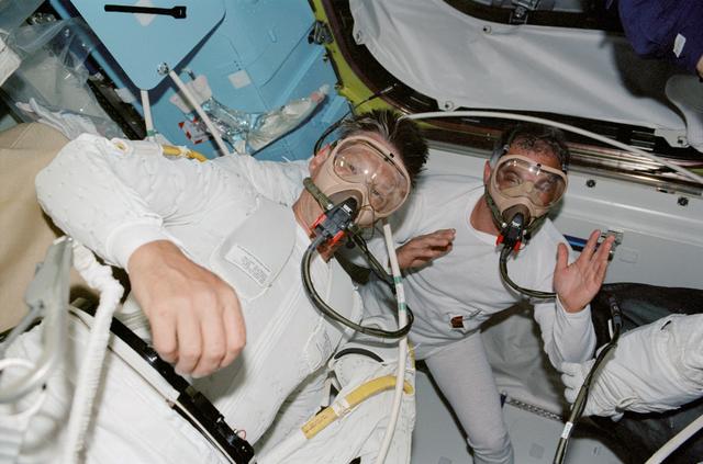 NASA image: MS Sellers and Wolf in Quest airlock for EVA 1