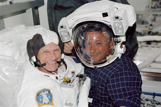 NASA image: STS-112 MS Sellers and MS Yurchikhin in airlock prior to EVA 3