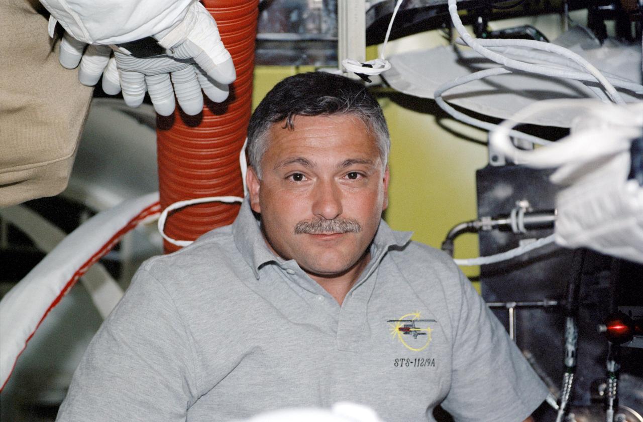STS112-325-030 (7-18 October 2002) --- Cosmonaut Fyodor N. Yurchikhin, STS-112 mission specialist representing Rosaviakosmos, is pictured in the Quest Airlock on the International Space Station (ISS).