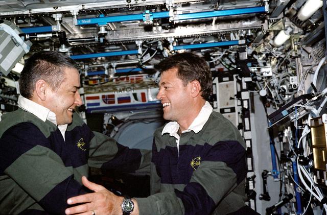 NASA image: Expedition 5 and STS-112 CDRs poses for portrait in Destiny module