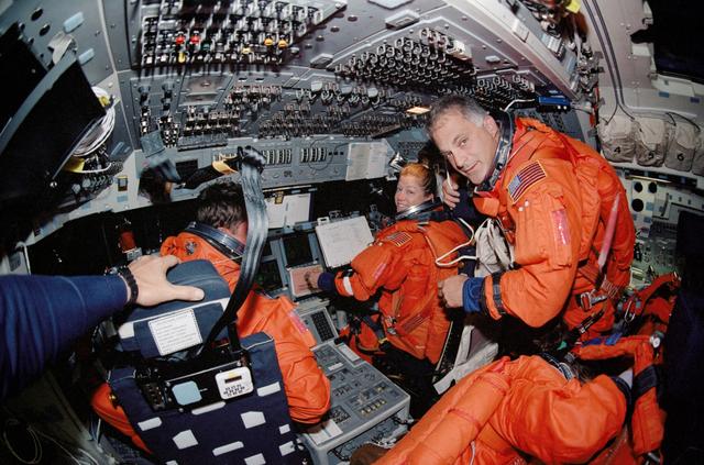 NASA image: Fish-eye view of PLT Melroy and MS Wolf on forward flight deck