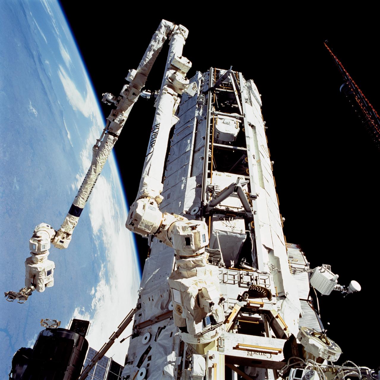STS112-709-033 (12 October 2002) --- A view of the Starboard One (S1) Truss newly installed on the International Space Station (ISS) as photographed during the mission&#0146;s second scheduled session of extravehicular activity (EVA). The station&#0146;s Canadarm2 is visible in left frame.
