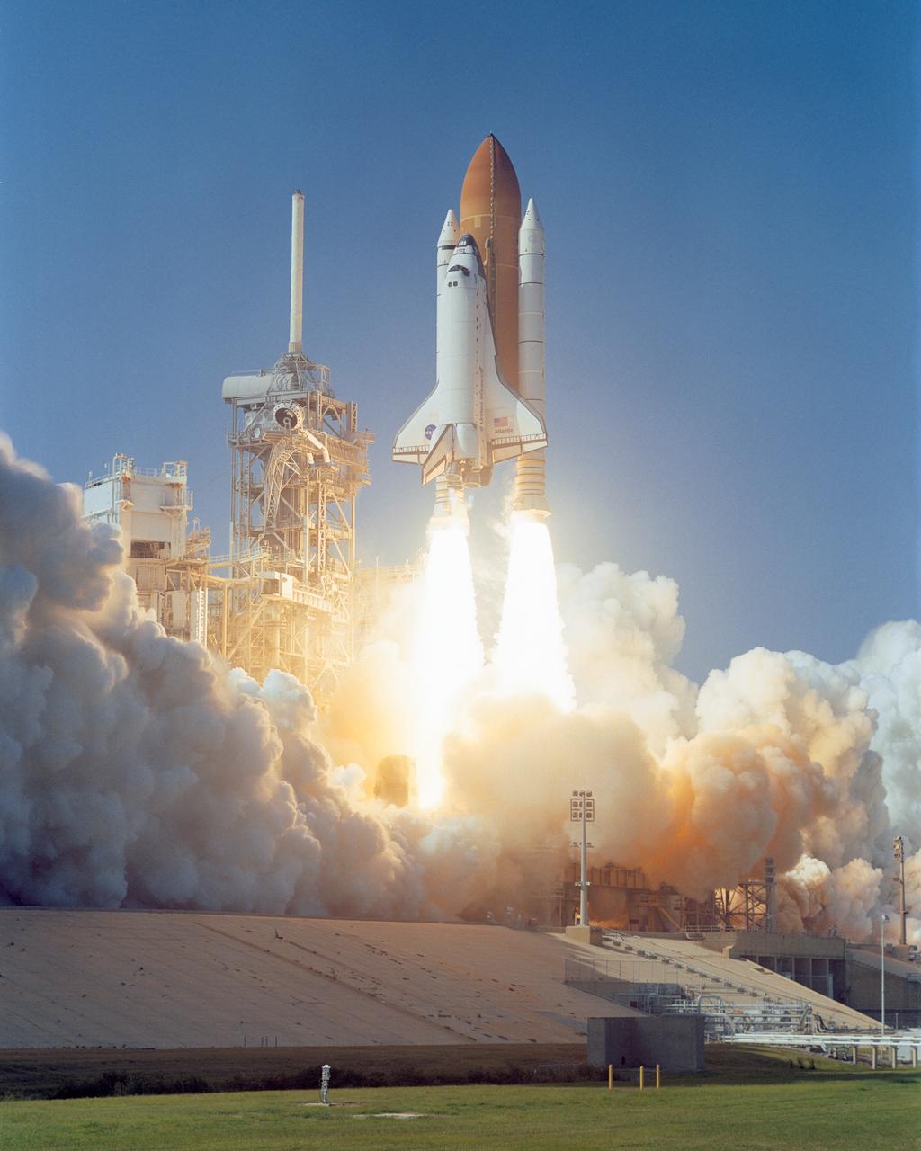 STS112-S-005 (7 October 2002) --- An automated camera records the launch of mission STS-112, the 15th assembly flight to the International Space Station. Liftoff from Launch Pad 39B occurred at 3:46 p.m. (EDT), October 7, 2002. Atlantis carried the S1 Integrated Truss Structure and the Crew and Equipment Translation Aid (CETA) Cart A. The CETA is the first of two human-powered carts that will ride along the ISS railway, providing mobile work platforms for future spacewalking astronauts. On the 11-day mission, three spacewalks were successful in attaching the S1 truss to the Station and performing other scheduled ISS work. The STS-112 crew members of Atlantis are Jeffrey S. Ashby, commander; Pamela A. Melroy, pilot; and David A. Wolf, Piers J. Sellers, Sandra H. Magnus and Rosaviakosmos' Fyodor N. Yurchikhin, all mission specialists.