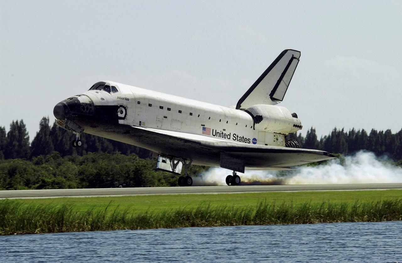 STS112-S-024 (18 October 2002) --- Space Shuttle Atlantis kicks up dust as it touches down at the Shuttle Landing Facility, completing the 4.5-million-mile journey that included a week of work with the International Space Station. Main gear touchdown occurred at 11:43:40 a.m. (EDT), October 18, 2002; nose gear touchdown at 11:43:48 a.m.; and wheel stop at 11:44:35 a.m. Mission elapsed time was 10:19:58:44. Mission STS-112 expanded the size of the Station with the addition of the S1 truss segment. The STS-112 crew members of Atlantis are Jeffrey S. Ashby, commander; Pamela A. Melroy, pilot; and David A. Wolf, Piers J. Sellers, Sandra H. Magnus and Rosaviakosmos' Fyodor N. Yurchikhin, all mission specialists.