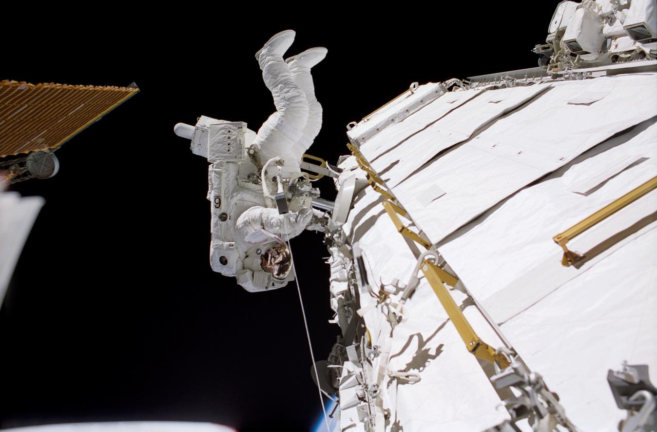 STS113-306-003 (30 November 2002) --- Astronaut John B. Herrington, STS-113 mission specialist, traverses along a truss on the International Space Station (ISS) during the mission’s third spacewalk.