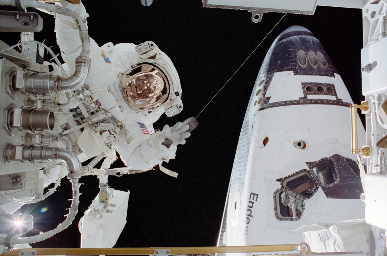 STS113-306-005 (30 November 2002) --- Astronaut John B. Herrington, STS-113 mission specialist, participates in the mission’s third and final scheduled spacewalk to perform work on the International Space Station (ISS). The forward section of the Space Shuttle Endeavour is in right frame.