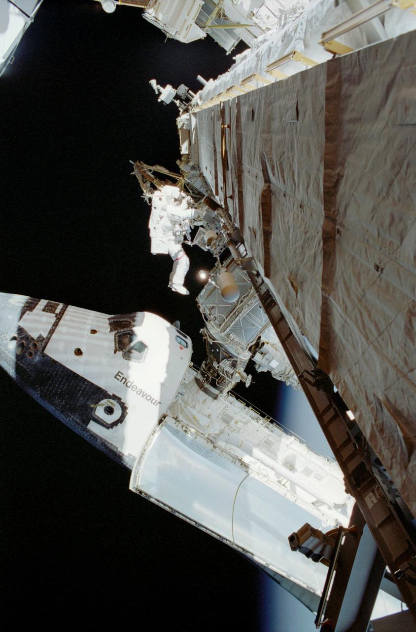STS113-308-002 (28 November 2002) --- Astronaut Michael E. Lopez-Alegria, STS-113 mission specialist, participates in the mission&#0146;s second scheduled spacewalk to perform work on the International Space Station (ISS). The Space Shuttle Endeavour, docked to the Pressurized Mating Adapter 2 (PMA-2), is visible below Lopez-Alegria.
