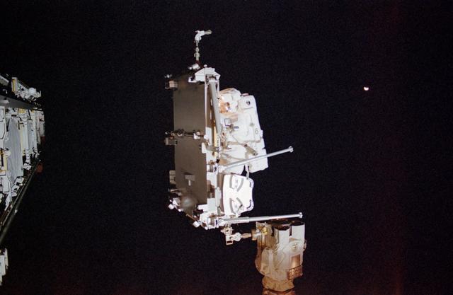NASA image: Herrington translates on SSRMS with CETA cart during STS-113 EVA 2