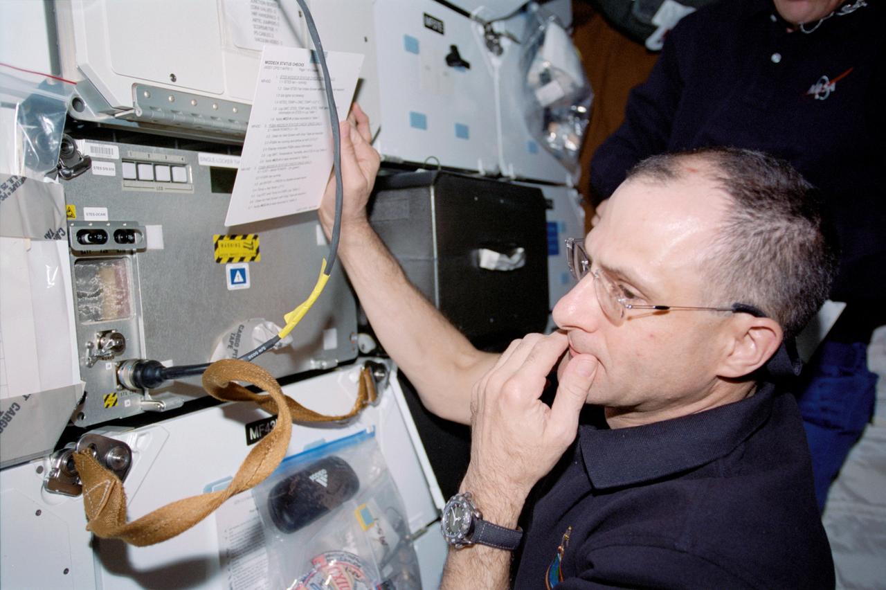 STS113-313-021 (23 November – 7 December 2002) --- Astronaut Donald R. Pettit, Expedition Six NASA ISS science officer, pictured on the middeck of the Space Shuttle Endeavour.