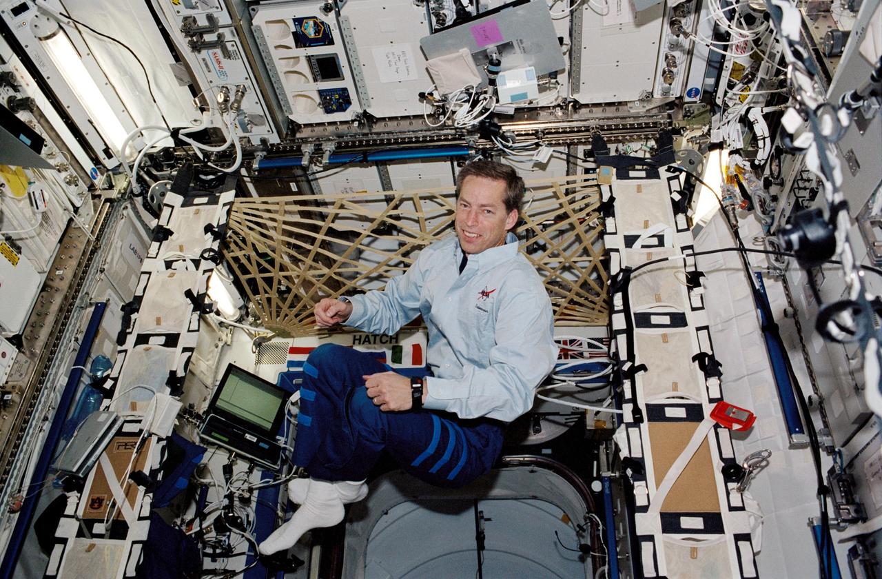 STS113-339-008 (1 December 2002) --- Astronaut James D. Wetherbee, STS-113 mission commander, floats in the Destiny laboratory on the International Space Station (ISS).