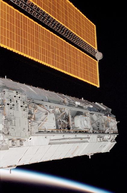 NASA image: P1 truss backdropped against Earth's limb with SA visible during STS-113