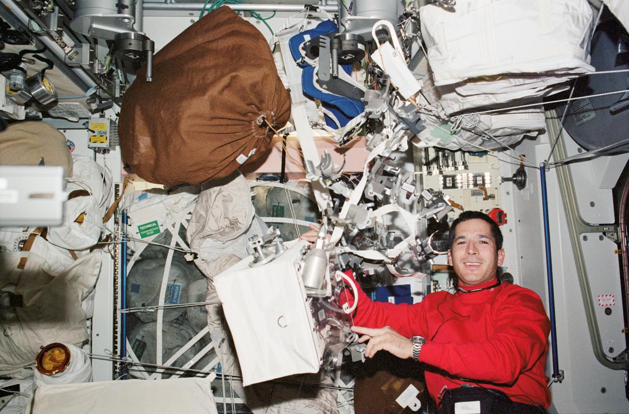 STS113-344-031 (23 November &#0150; 7 December 2002) --- Astronaut John B. Herrington, STS-113 mission specialist, is pictured in the Unity node on the International Space Station (ISS). Various extravehicular activity (EVA) tools float near Herrington.