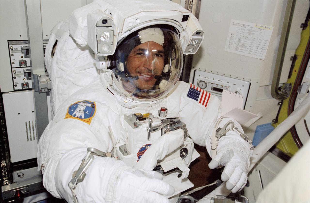 STS113-360-023 (26 November 2002) --- Astronaut John B. Herrington, STS-113 mission specialist, attired in his Extravehicular Mobility Unit (EMU) spacesuit, is pictured in the Quest Airlock on the International Space Station (ISS). Herrington was about to begin the first of three scheduled STS-113 spacewalks to perform work on the station. In cooperation with the rest of the shuttle and station crewmembers, Herrington and Michael E. Lopez-Alegria went on to complete a smooth spacewalk to hook up connections between the Port One (P1) truss and the rest of the station.