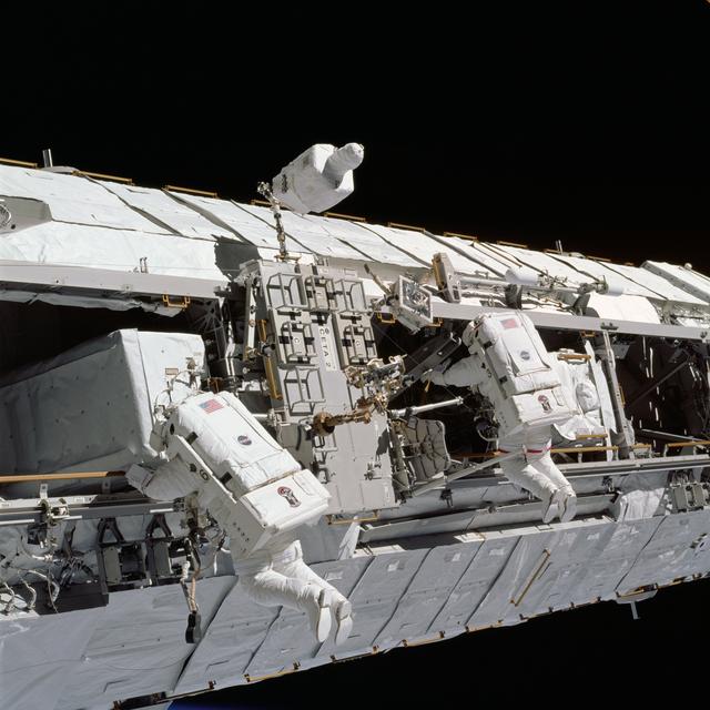 NASA image: Lopez-Alegria and Herrington work near CETA cart 2 during STS-113 EVA OPS