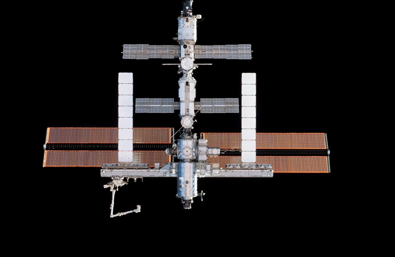 STS115-301-008 (11 Sept. 2006) --- Backdropped against the blackness of space, the International Space Station was photographed by one of the STS-115 crewmembers as the Space Shuttle Atlantis approached the station during rendezvous and docking activities on flight day three.