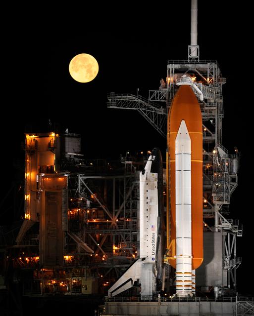 NASA image: STS-119 Shuttle Discovery With Moon