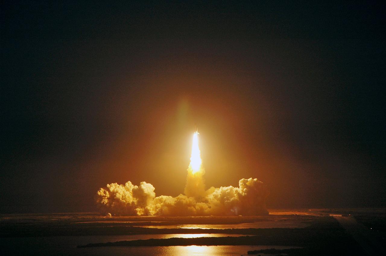 STS119-S-021 (15 March 2009) --- The Space Shuttle Discovery and its seven-member STS-119 crew head toward Earth orbit and a scheduled link-up with the International Space Station. Liftoff was on time at 7:43 p.m. (EDT) on March 15, 2009 from launch pad 39A at NASA’s Kennedy Space Center. Onboard are astronauts Lee Archambault, commander; Tony Antonelli, pilot; Joseph Acaba, Steve Swanson, Richard Arnold, John Phillips and Japan Aerospace Exploration Agency’s Koichi Wakata, all mission specialists. Wakata will join Expedition 18 in progress to serve as a flight engineer aboard the space station. Discovery will deliver the final pair of power-generating solar array wings and the S6 truss segment. Installation of S6 will signal the station's readiness to house a six-member crew for conducting increased science.