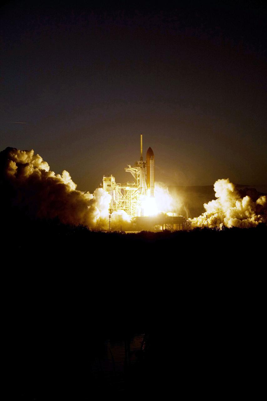 STS119-S-022 (15 March 2009) --- The Space Shuttle Discovery and its seven-member STS-119 crew head toward Earth orbit and a scheduled link-up with the International Space Station. Liftoff was on time at 7:43 p.m. (EDT) on March 15, 2009 from launch pad 39A at NASA’s Kennedy Space Center. Onboard are astronauts Lee Archambault, commander; Tony Antonelli, pilot; Joseph Acaba, Steve Swanson, Richard Arnold, John Phillips and Japan Aerospace Exploration Agency’s Koichi Wakata, all mission specialists. Wakata will join Expedition 18 in progress to serve as a flight engineer aboard the space station. Discovery will deliver the final pair of power-generating solar array wings and the S6 truss segment. Installation of S6 will signal the station's readiness to house a six-member crew for conducting increased science.