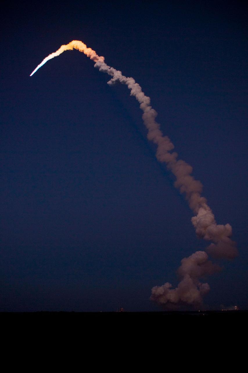 STS119-S-027 (15 March 2009) --- The Space Shuttle Discovery and its seven-member STS-119 crew head toward Earth orbit and a scheduled link-up with the International Space Station. Liftoff was on time at 7:43 p.m. (EDT) on March 15, 2009 from launch pad 39A at NASA’s Kennedy Space Center. Onboard are astronauts Lee Archambault, commander; Tony Antonelli, pilot; Joseph Acaba, Steve Swanson, Richard Arnold, John Phillips and Japan Aerospace Exploration Agency’s Koichi Wakata, all mission specialists. Wakata will join Expedition 18 in progress to serve as a flight engineer aboard the space station. Discovery will deliver the final pair of power-generating solar array wings and the S6 truss segment. Installation of S6 will signal the station's readiness to house a six-member crew for conducting increased science.