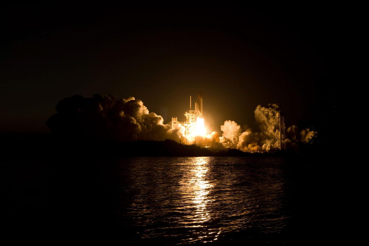STS119-S-030 (15 March 2009) --- The Space Shuttle Discovery and its seven-member STS-119 crew head toward Earth orbit and a scheduled link-up with the International Space Station. Liftoff was on time at 7:43 p.m. (EDT) on March 15, 2009 from launch pad 39A at NASA’s Kennedy Space Center. Onboard are astronauts Lee Archambault, commander; Tony Antonelli, pilot; Joseph Acaba, Steve Swanson, Richard Arnold, John Phillips and Japan Aerospace Exploration Agency’s Koichi Wakata, all mission specialists. Wakata will join Expedition 18 in progress to serve as a flight engineer aboard the space station. Discovery will deliver the final pair of power-generating solar array wings and the S6 truss segment. Installation of S6 will signal the station's readiness to house a six-member crew for conducting increased science.