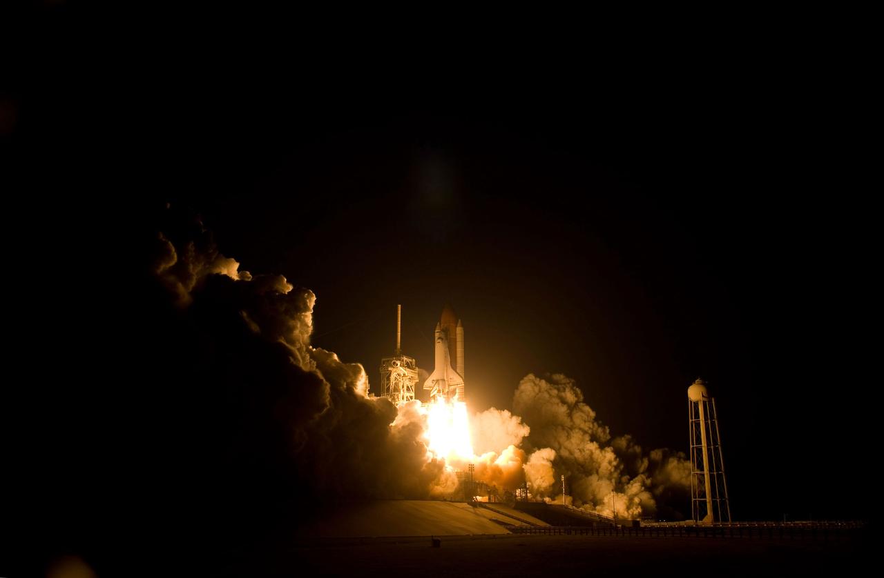 STS119-S-032 (15 March 2009) --- The Space Shuttle Discovery and its seven-member STS-119 crew head toward Earth orbit and a scheduled link-up with the International Space Station. Liftoff was on time at 7:43 p.m. (EDT) on March 15, 2009 from launch pad 39A at NASA’s Kennedy Space Center. Onboard are astronauts Lee Archambault, commander; Tony Antonelli, pilot; Joseph Acaba, Steve Swanson, Richard Arnold, John Phillips and Japan Aerospace Exploration Agency’s Koichi Wakata, all mission specialists. Wakata will join Expedition 18 in progress to serve as a flight engineer aboard the space station. Discovery will deliver the final pair of power-generating solar array wings and the S6 truss segment. Installation of S6 will signal the station's readiness to house a six-member crew for conducting increased science.